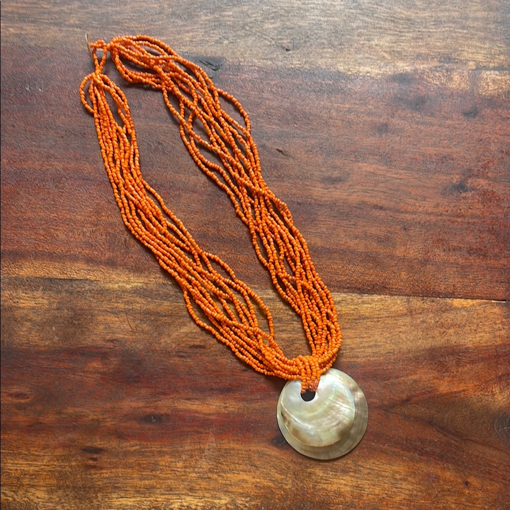 Handmade Orange Beaded Necklace with Shell Pendant from Kenya